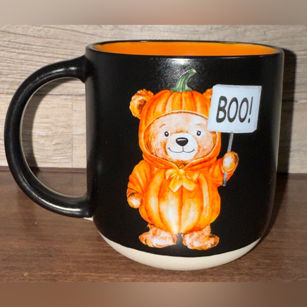 Teddy Bear 🧸 Wearing a Pumpkin 🎃 Costume and Holding a Sign that says "BOO!" Mug